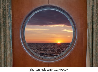 View Of A Sunrise Through A Cruise Ship Window