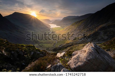 A view of sunset from Green Crag in the Lake District looking down to Buttermere Fell and Buttermere with views of High Crag, Great Crag, Red Pike, High Snockrigg, Rannerdale Knotts and Fleetwith Pike