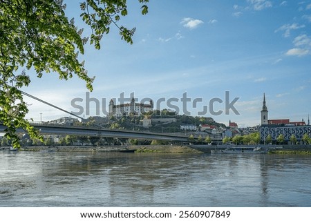 View of the sunset from the old bridge towards the SNP bridge and Bratislava Castle. Danube River. Slovakia.