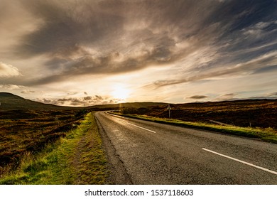 View Of The Sunset On A Solitary Road In The Isle Of Skye