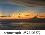 view of the sunset with the orange clouds and blue sky