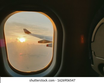 A view of the sunset from a plane window.