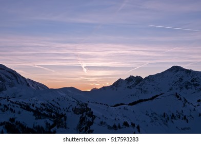 View Of Sunset Sky In Snowy Mountains.