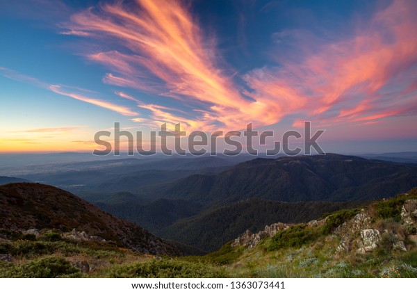 The view at\
sunset from the summit of Mt Buller over the Victorian Alps in the\
Victorian High Country,\
Australia