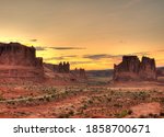 View To The Sunset At The Three Gossips, Sheep Rock, Tower Of Babel And The Organic From Courthose Towers Viewpoint Arches National Park Utah On A Sunny Summer Day With A Clear Blue Sky