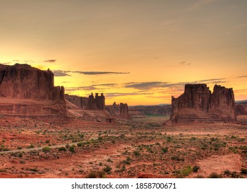 View To The Sunset At The Three Gossips, Sheep Rock, Tower Of Babel And The Organic From Courthose Towers Viewpoint Arches National Park Utah On A Sunny Summer Day With A Clear Blue Sky