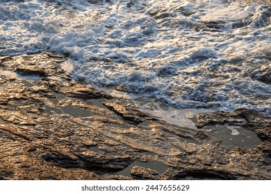 View of the surf on the rocky beach during sunset - Powered by Shutterstock