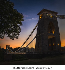 View of  suspension bridge over a gorge at sunset on summer night - Shutterstock ID 2369847637