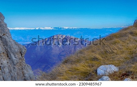 The view from Suva Planina to the snowy peaks of Stara Planina