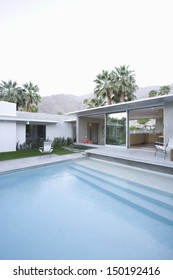 View Of Swimming Pool And Modern Home Exterior