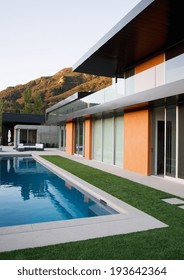 View Of Swimming Pool And Modern Home Exterior