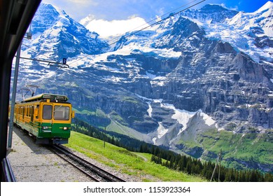 View Of The Swiss Alps From The Window Of The Express Train