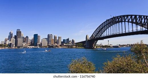 View At Sydney City CBD And Harbour Bridge Over Harbor Water Sunny Day Panorama