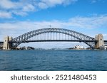 View of Sydney Harbour Bridge from ferry with Sydney Opera House in the background