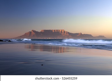 view of table mountain from bloubergstrand in  cape town south africa