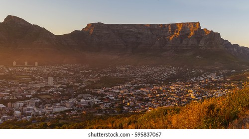 A view of Table Mountain from the road across Signal Hill the moment the sun rises