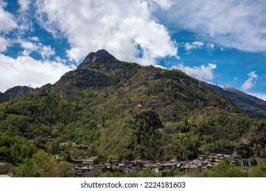 View Of A Tall Mountain With Blue Sky On The Background
