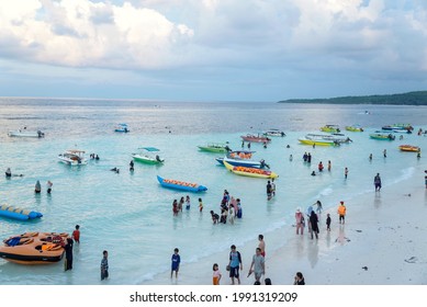 View of Tanjung Bira Beach, South Celebes, Indonesia during holiday season on 2019. Tourists enjoy the beautiful white sands, blue sea and sky, banana boat and yachts. grunge texture. selective focus