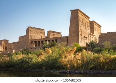 View Of The Temple Of Isis At Philae, Taken From The Nile River.  The New Kingdom Temple Complex Was Moved From Philae To Agilika Island In 1902 Due To Flooding Cause By The Aswan Low Dam.