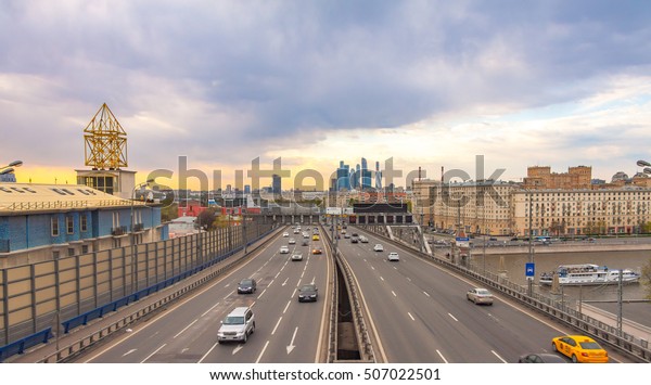 View of Third Transport Ring, busy highway in\
Moscow at sunset, urban\
landscape