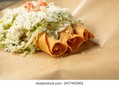 A view of three taquitos.