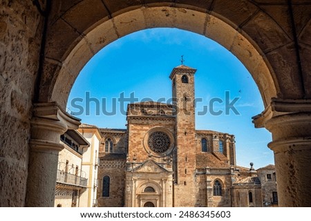 View, through an arch, of the side facade of the cathedral of Santa María de Sigüenza, Guadalajara, Castilla-la Mancha, Spain