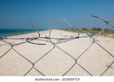 View Through The Barbed Wire To The Beach And The Sea. Natural Reserve. No Entry