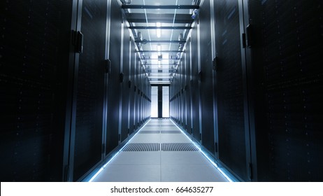 View Through Big Working Data Center with Server Racks.