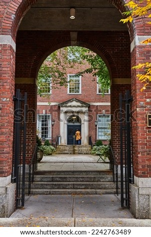 View through brick arches of law student in courtyard of New York City