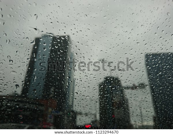 view through car\
window with rain drops