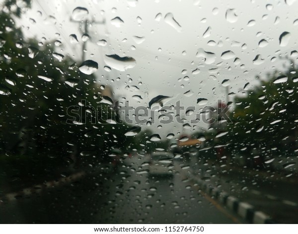 view through car window\
rain drops