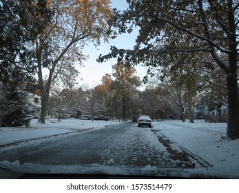 View Through A Car Windshield Of A Snow Covered Street In Columbus, Ohio