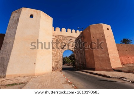 View through city wall gate on a sunny day in Meknes, Morocco