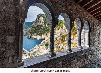 View through columns of Church of St. Peter in Portovenere or Porto Venere town on Ligurian coast. Province of La Spezia. Italy