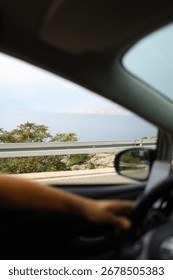 View through the front window of the car, sea view, travel around Croatia