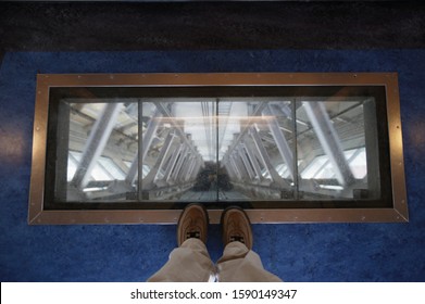 View through glass floor in elevator of Sky Tower, Auckland, New Zealand