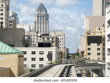 The View Through The Monorail Train Window Of Miami Downtown Buildings (Florida).