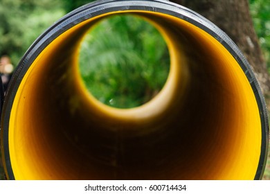 View through a plastic drain spout