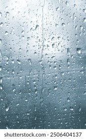 view through the raindrop window on rainy day in vertical