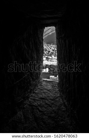 View through a small window of an ancient house in Ushguli village in Svaneti. Georgia. Toned.