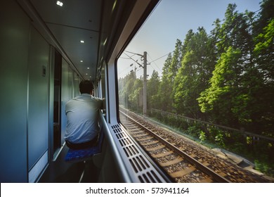 View Through The Train Window. Sunrise Time. Motion Blur Effect.