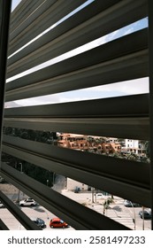 View through the window behind the blinds