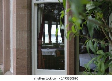 view through a window inside a hotel restaurant