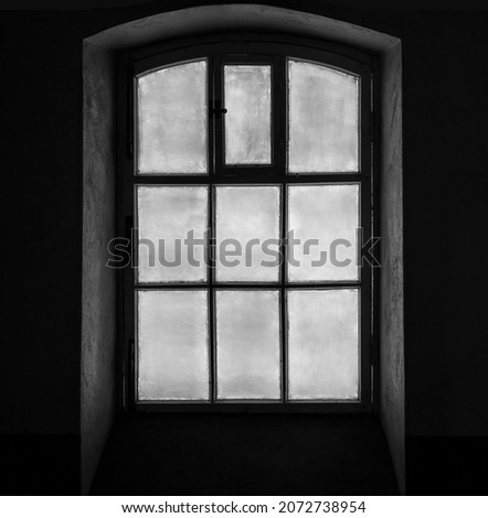 The view through the window of the old house on the facades of the buildings of the courtyard. Saint-Petersburg. Shlisselburg prison, Leningrad region, Russia.