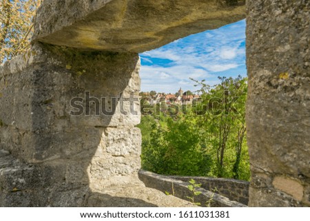 View through a window of the town wall on Rothenburg ob der Tauber in Bavaria Germany