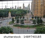 View through a window-wall of  Central Park with the Upper East Side on the horizon, from high up in The Shops at Columbus Circle complex in New York City 