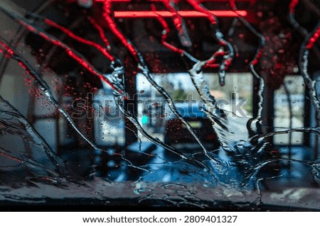 View through the windshield at an automatic tunnel car wash.