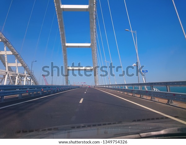 View through the windshield of a moving car.
Crimea, Russia - June, 8, 2018: Travel on the Crimean bridge during
its construction. View from the
car