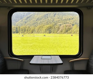 View Throught Window In Train To Three Cyclists Driving By Green Field Among Mountains Landscape With Copy Space For Text Overlay, Rare Moment In Summer Nature, Travel Destinations, Wallpaper