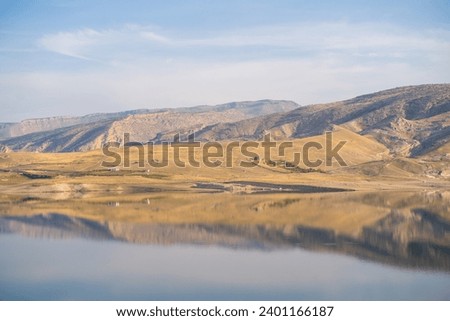View of the Tigris River. Reflection of the mountains in the river.